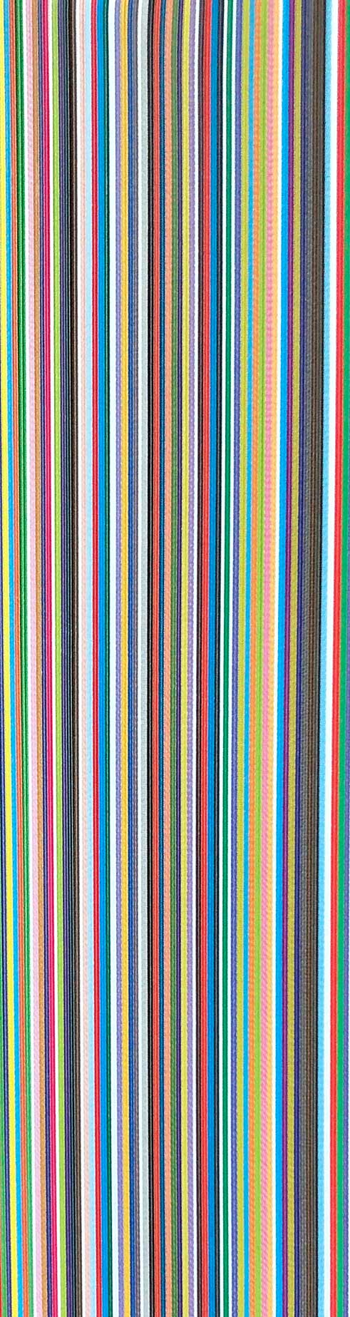 Up close on the front section of a book, showing the colorful profile the pages make together when being closed.