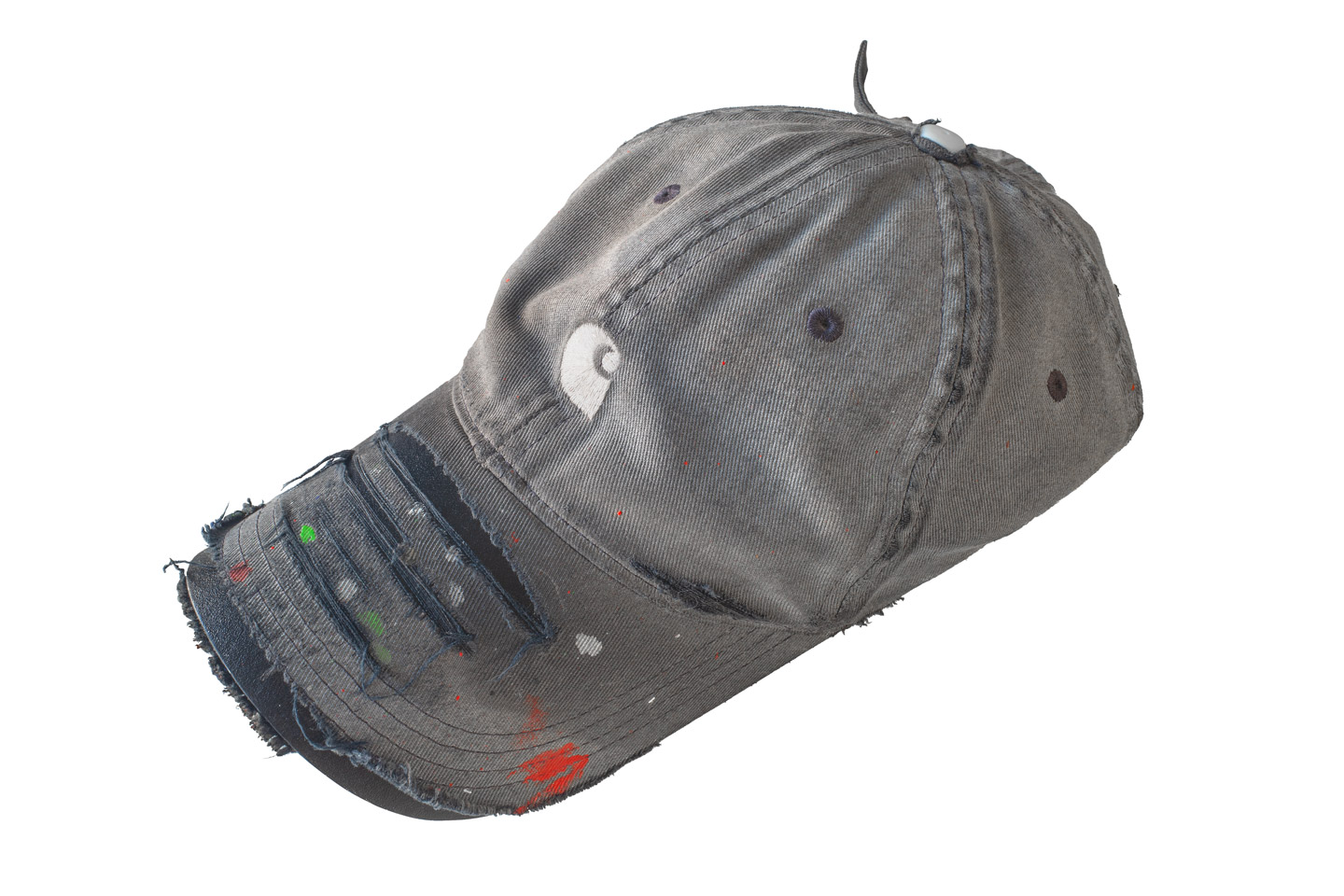 A very worn-out black Carhartt cap, with paint stains all over.